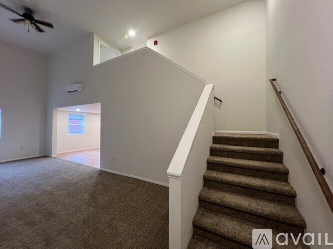 A room with a staircase leading to the second floor.