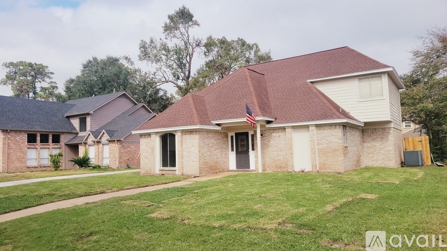 A house with a red roof and a flag on it.