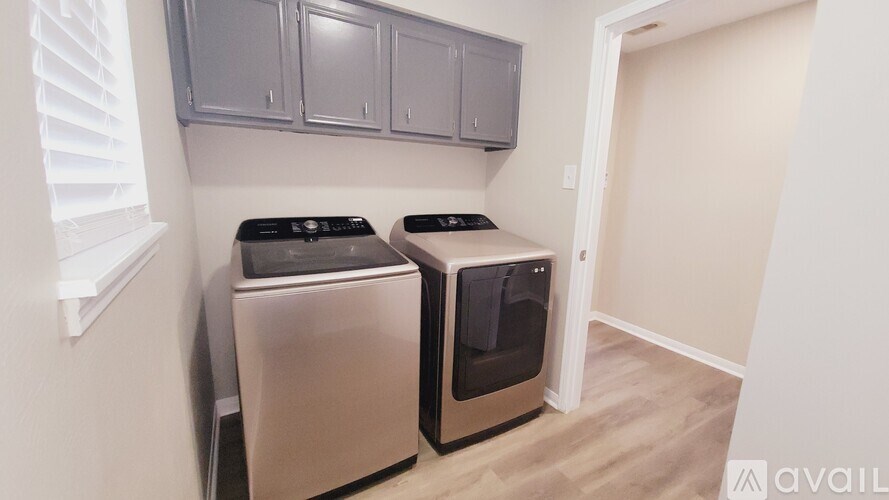 A kitchen with two ovens and a wall of cabinets.