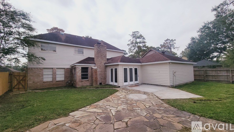 A house with a stone pathway leading to the front door.