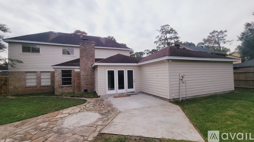 A house with a stone pathway leading to the front door.