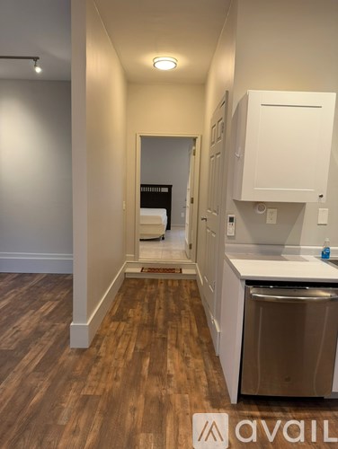 A kitchen area with a sink and cabinets.