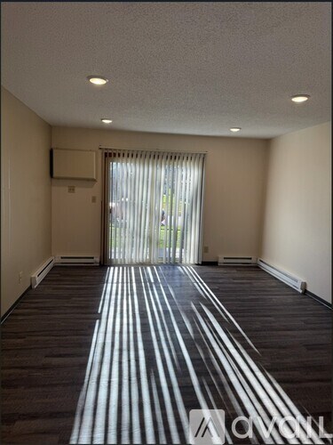 A room with a striped shadow effect on the floor.