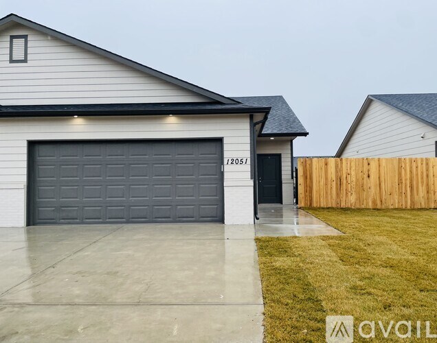 A house with a garage door numbered 172051 is available for purchase.