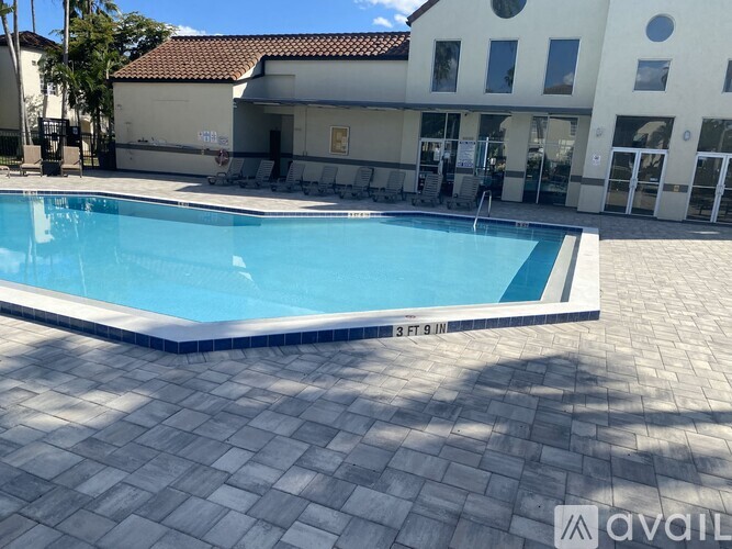 A pool in front of a building with the text "available" on the bottom right.