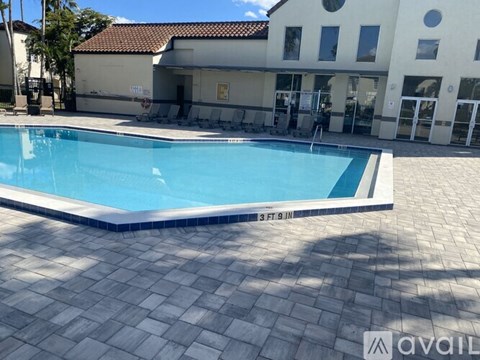 A pool in front of a building with the text "available" on the bottom right.