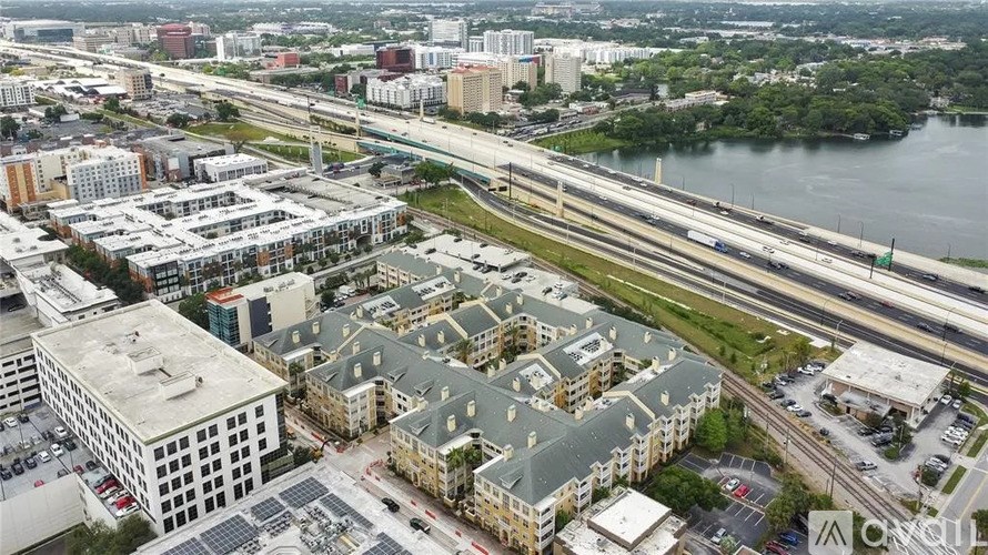 A cityscape with a highway and buildings.