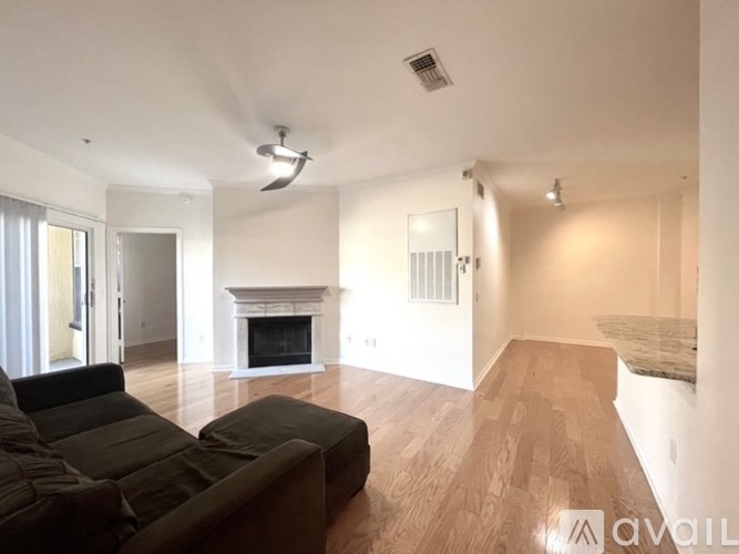 A living room with a fireplace and a couch.