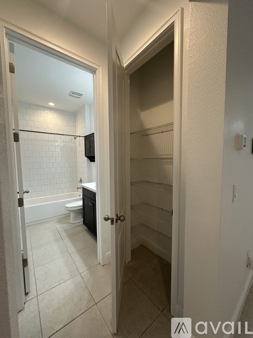 A bathroom with a walk-in shower and a toilet.