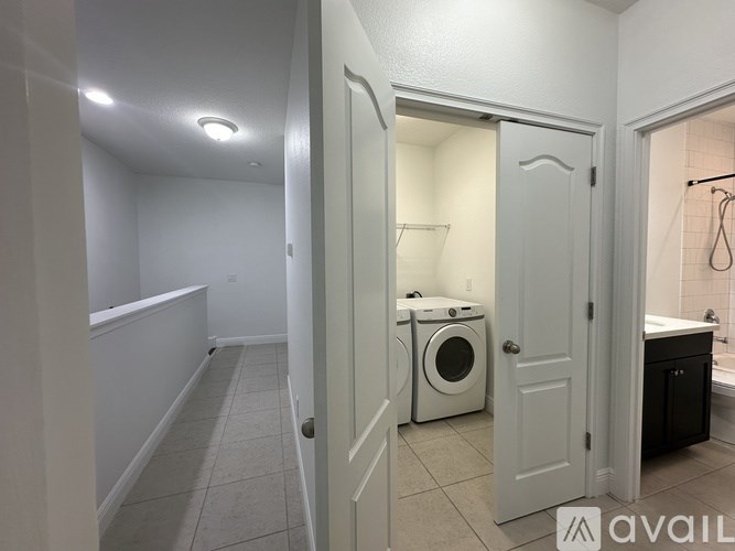 A laundry room with a washer and dryer.