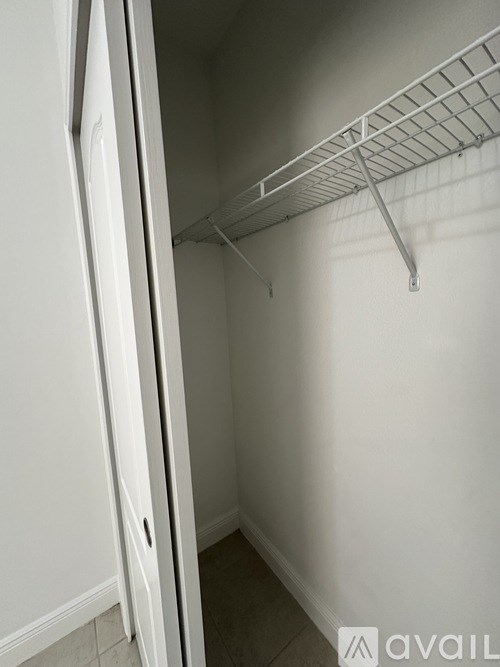 Empty white shelves in a white room.