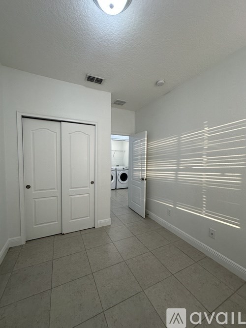 A laundry room with a washer and dryer.