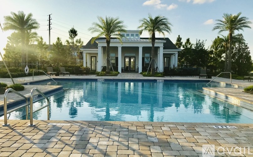 A large house with a pool in front of it.