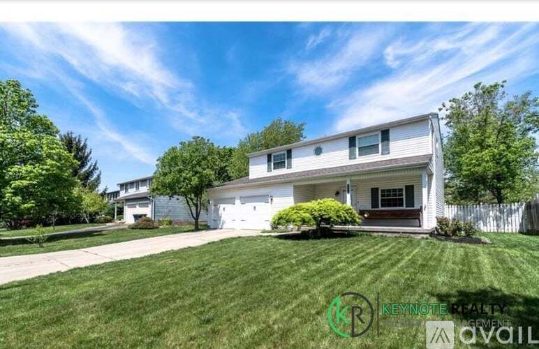 A house with a lawn in front of it is for sale.