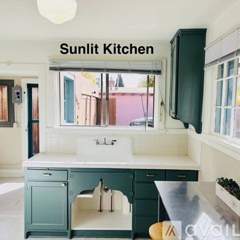 A kitchen with a sign that says Sunlit Kitchen.