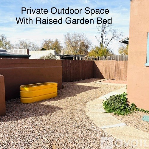 A private outdoor space with a raised garden bed.