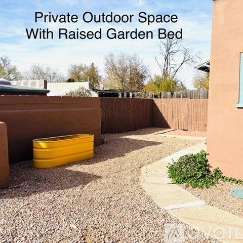 A private outdoor space with a raised garden bed.