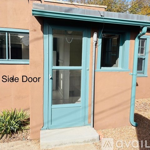 A blue door with a sign that says side door.