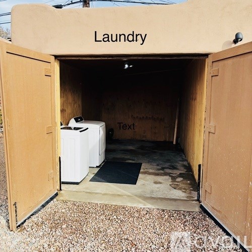 A small laundry room with a washer and dryer.