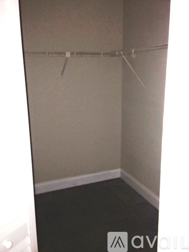 A room with a clothes hanger on the wall.