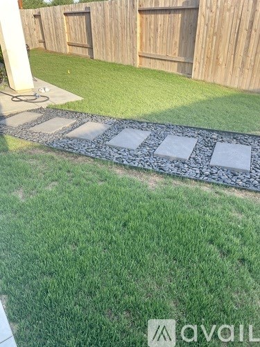 A garden pathway made of stone slabs.