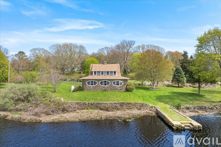 A house with a dock in front of it is for sale.
