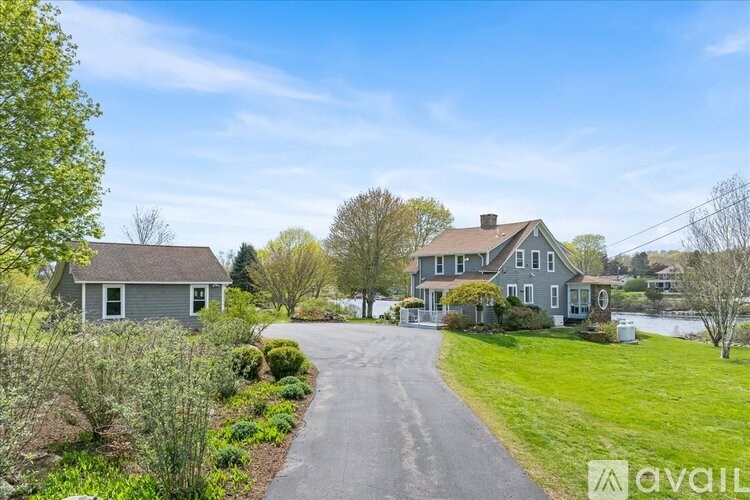 A house with a driveway in front of it.