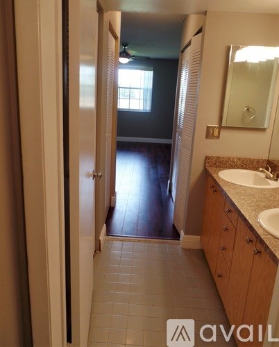A bathroom with a sink and a mirror.