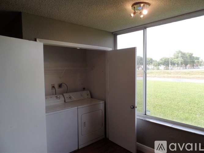 A laundry room with a washer and dryer in it.