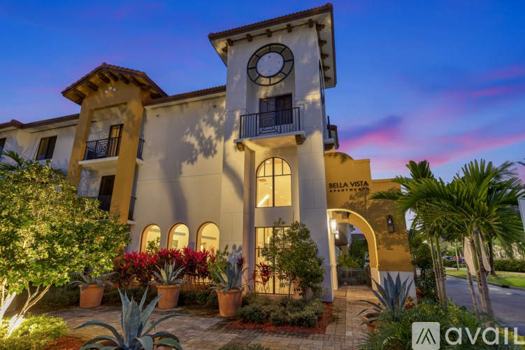 A building with a clock tower and the words "Bella Vista" on it.
