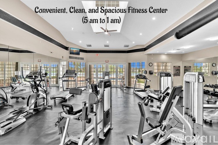 A spacious fitness center with a variety of equipment.