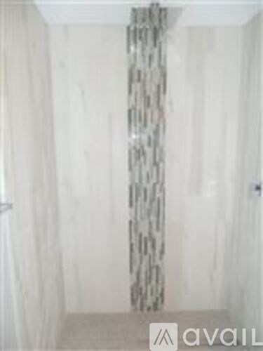 A room with a patterned curtain on the window.