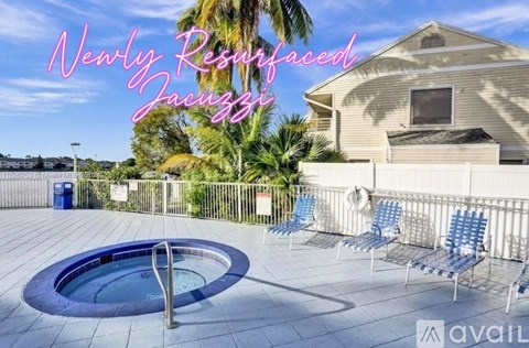 A newly refurbished property with a hot tub on the deck.