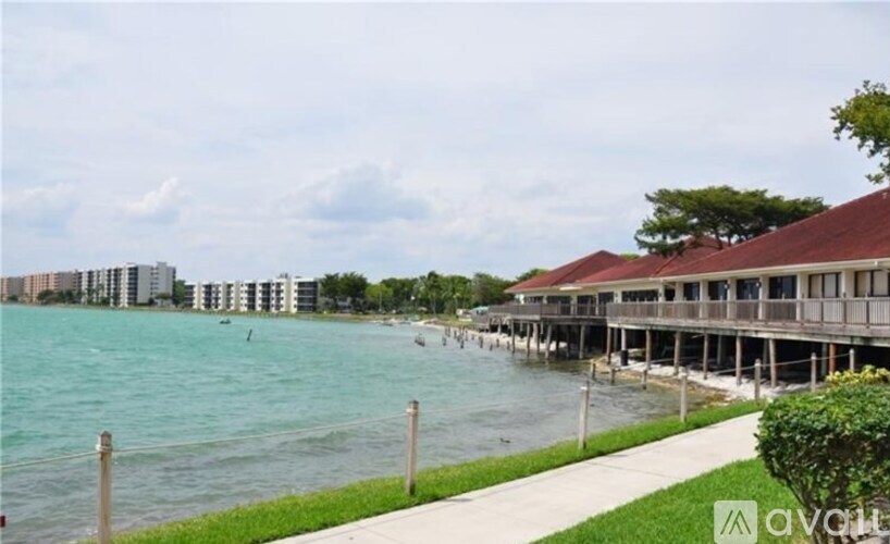 A long wooden pier extends into a body of water.