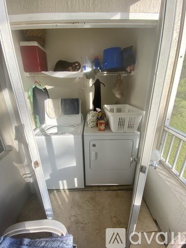 A small kitchen with a washing machine and a dishwasher.