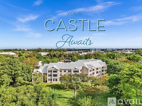A large, castle-like building with the words "Your CASTLE Awaits" written above it.
