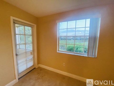 A room with a window and a door.