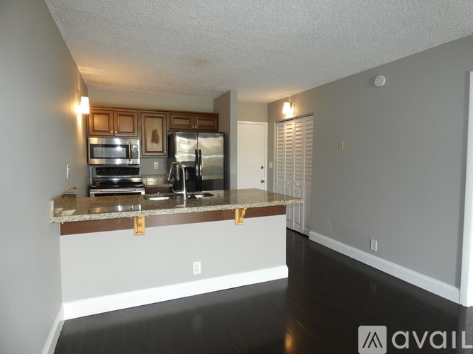 A kitchen with a counter and cabinets.