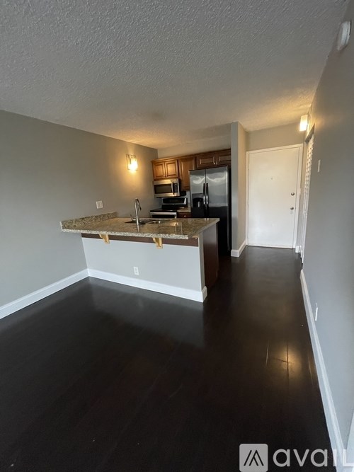 A kitchen with a countertop and cabinets.