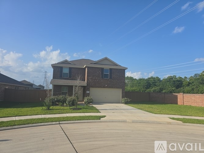 A house with a driveway in front of it is for sale.