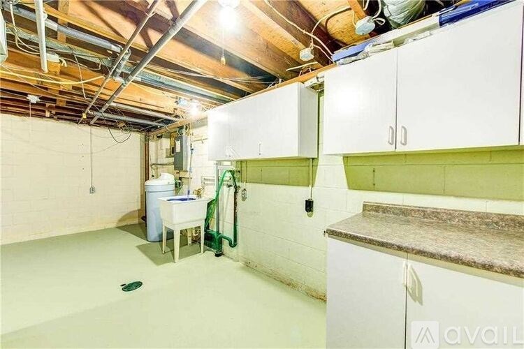 A room with a table and chairs in it.