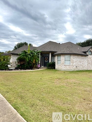 A house with a lawn in front of it.