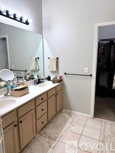 A bathroom with a vanity and a mirror.