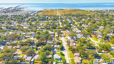 A bird's eye view of a residential area with houses and streets.