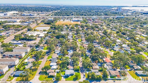 A bird's eye view of a residential area with houses and trees.
