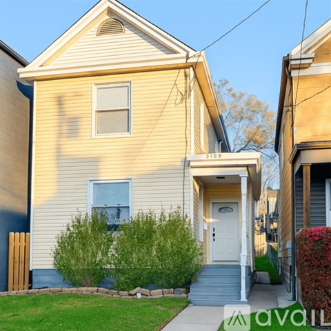 A house with a white door and a window is shown.
