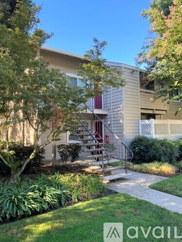 A building with a tree in front of it.