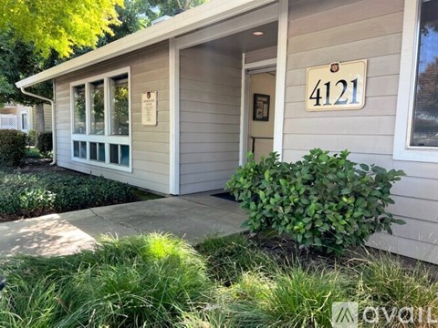 A small house with the number 4121 on the front.