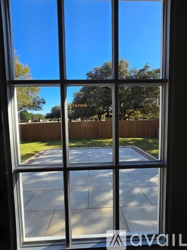 A view of a backyard through a window.