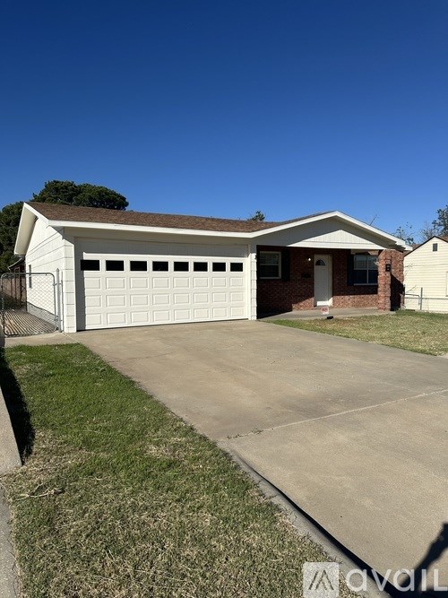A two-car garage is attached to a house.